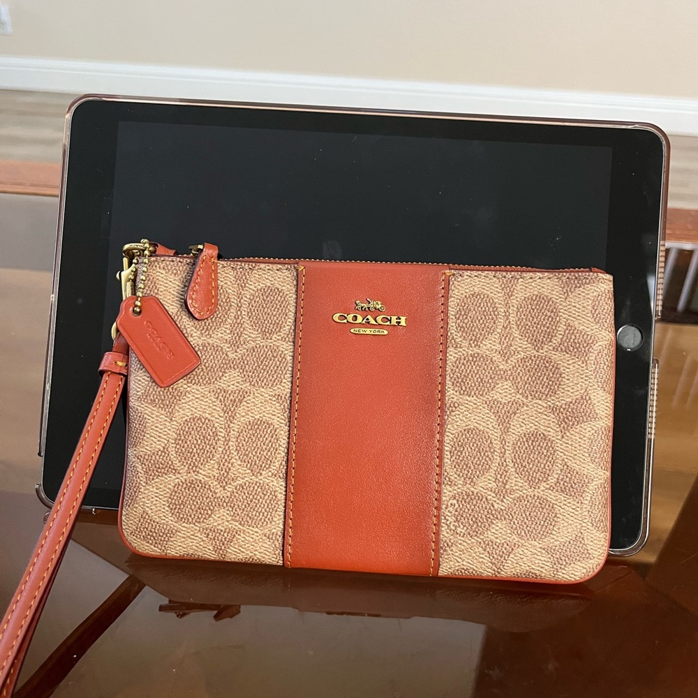 Coach Signature Wristlet tan rust colors